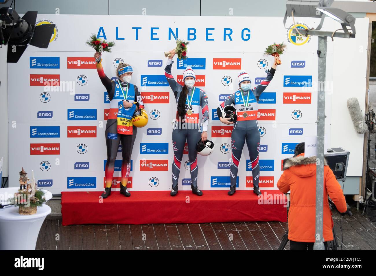 Altenberg, Germany. 05th Dec, 2020. Luge: World Cup, singles, ladies, second heat. Natalie Geisenberger (l-r) from Germany, Tatjana Iwanowa from Russia and Ekaterina Katnikowa from Russia stand side by side during the award ceremony. Credit: Sebastian Kahnert/dpa-Zentralbild/dpa/Alamy Live News Stock Photo