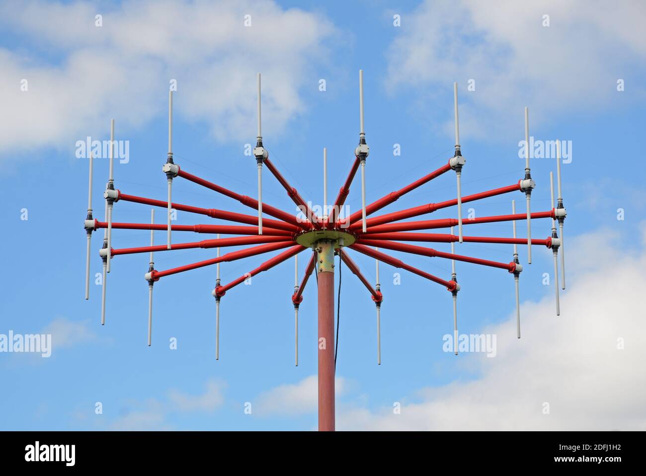 Red airfield antenna with dipoles on sky background Stock Photo