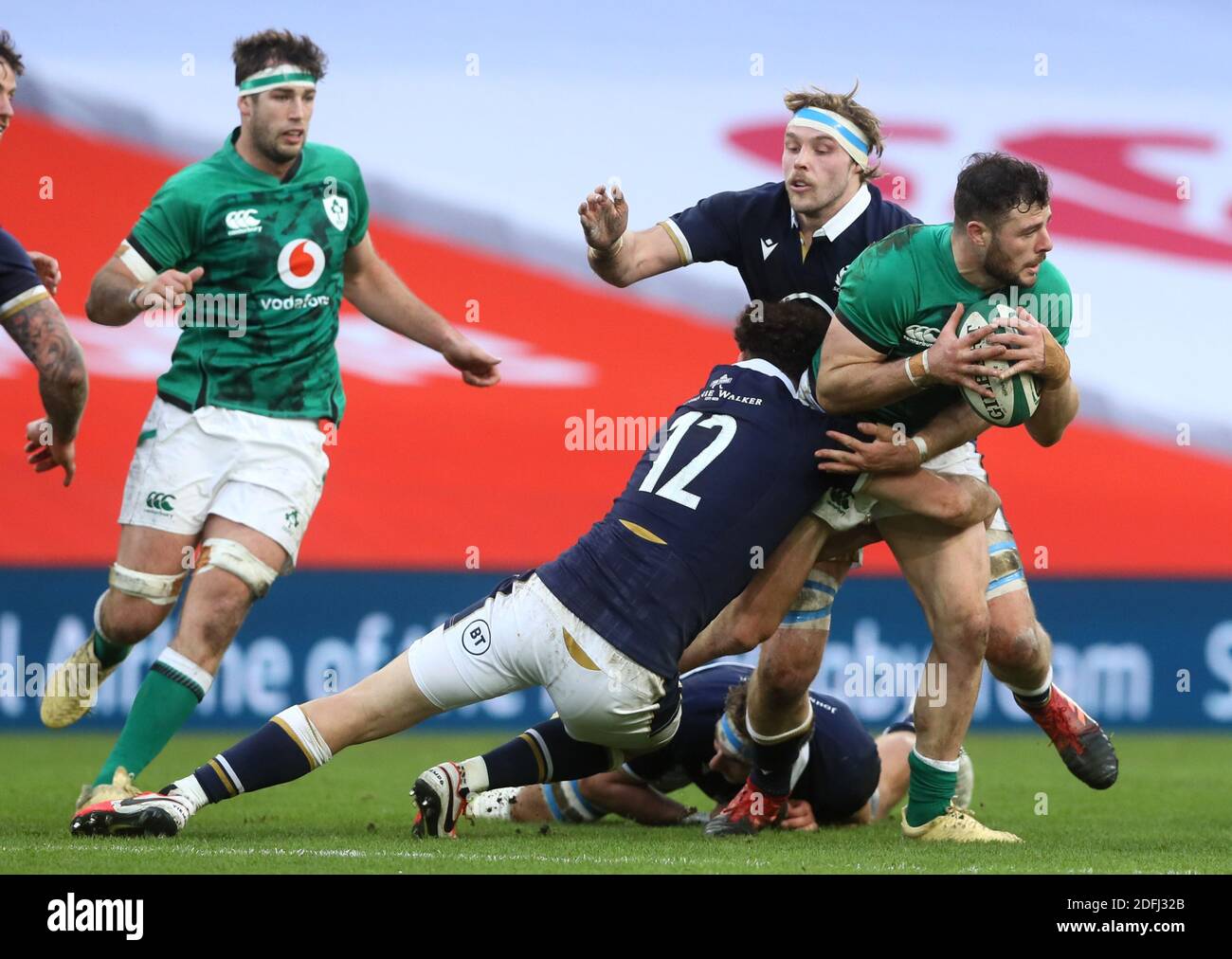 Ireland's Robbie Henshaw (right) tackled by Scotland's Duncan Taylor and Jonny Gray during the Autumn Nations Cup match at the Aviva Stadium, Dublin. Stock Photo