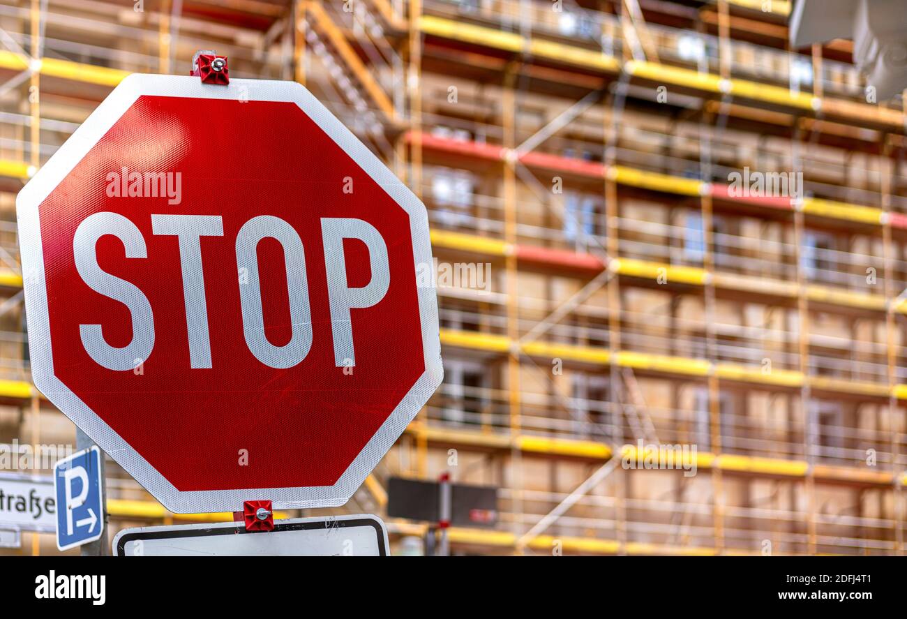 Stop Sign In Front Of Scaffolding Stock Photo