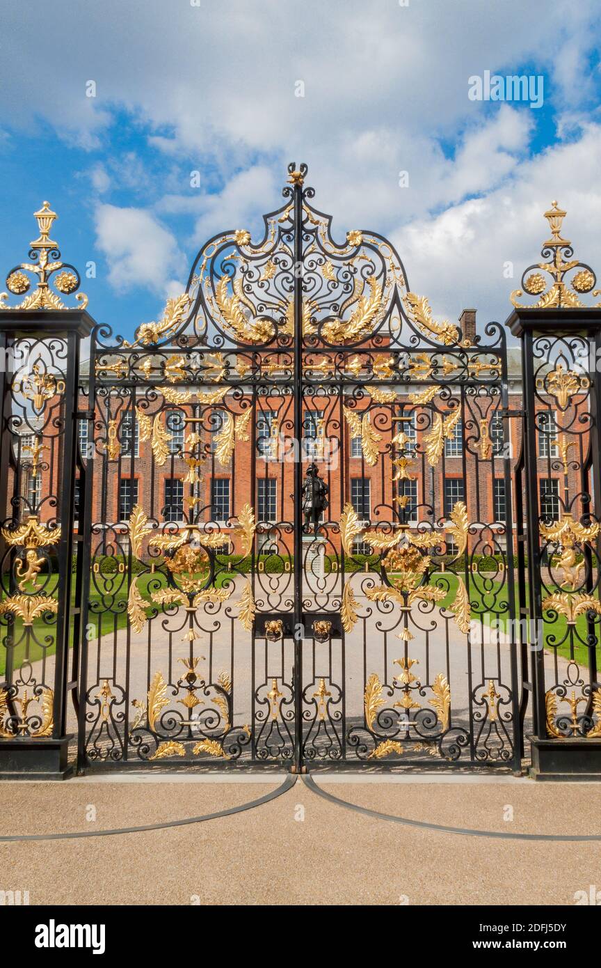 Kensington Palace gates in Kensington Gardens London England UK which was designed by Sir Christopher Wren for William III in 1689 and is a popular tr Stock Photo