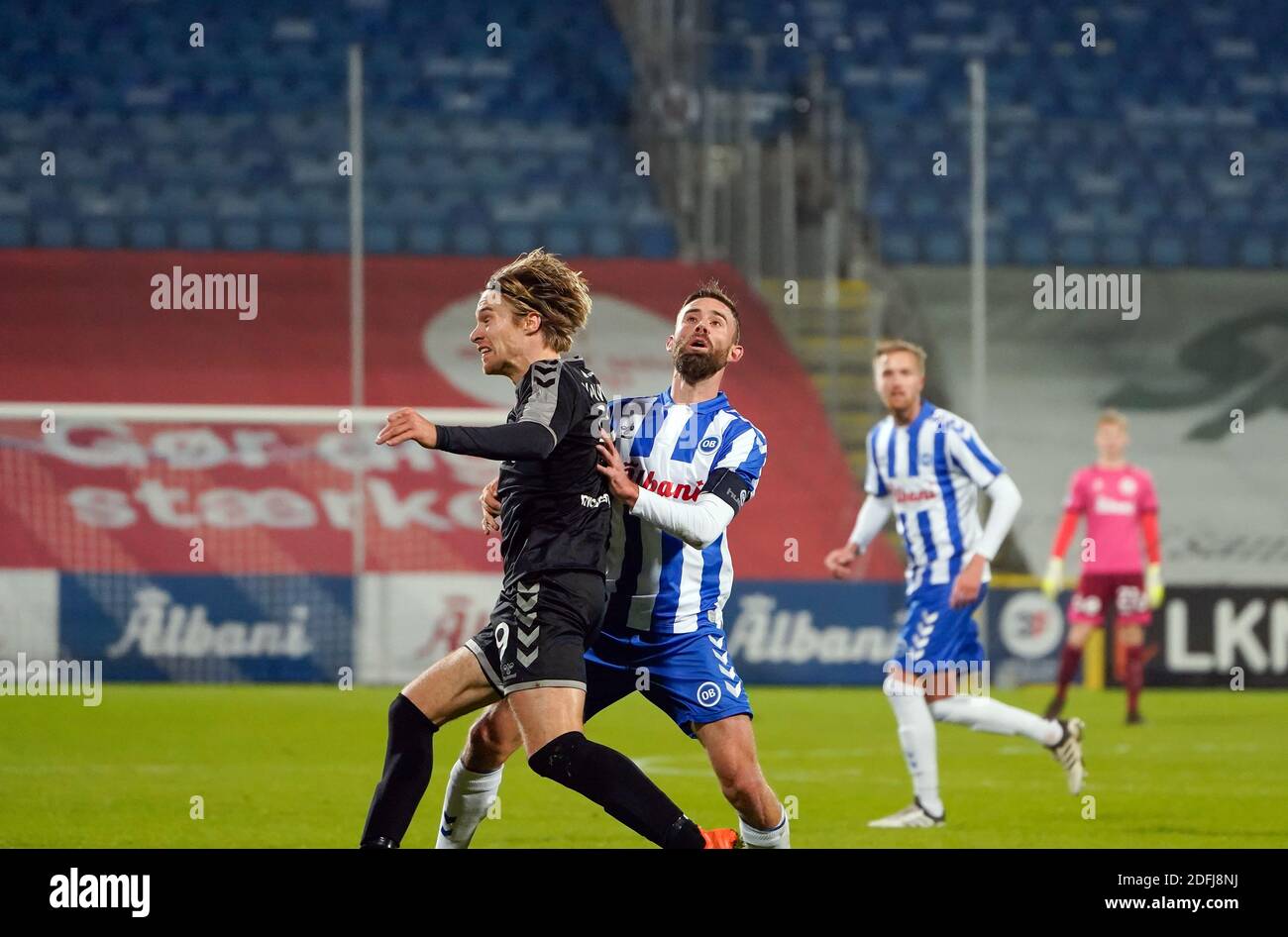 Odense, Denmark. 04th Dec, 2020. Janus Drachmann (8) of OB and Tom van  Weert (9) of AAB seen during the 3F Superliga match between Odense Boldklub  and Aalborg Boldklub at Nature Energy