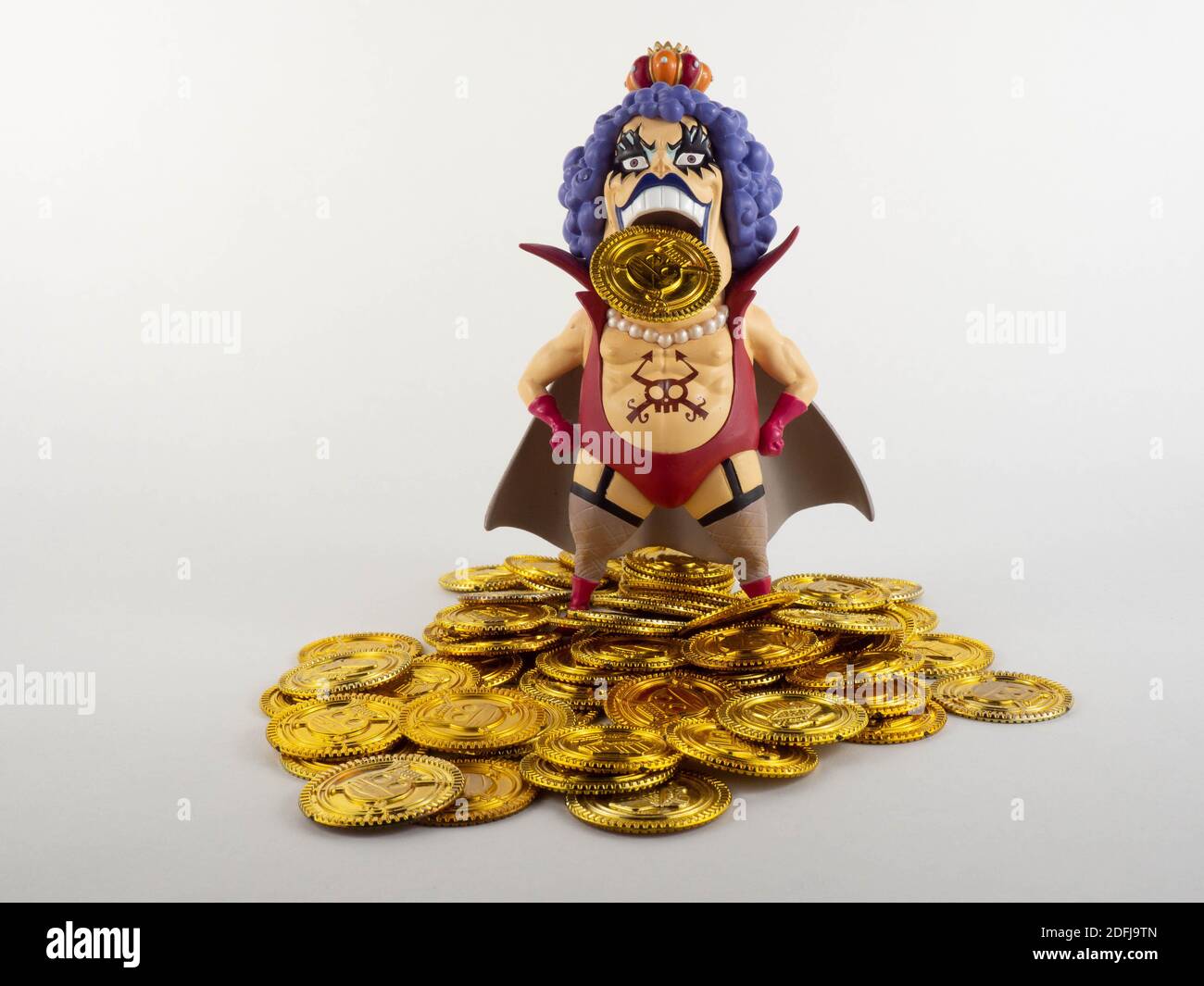 A tall pirate on a pile of gold. Concept around money and piracy Stock