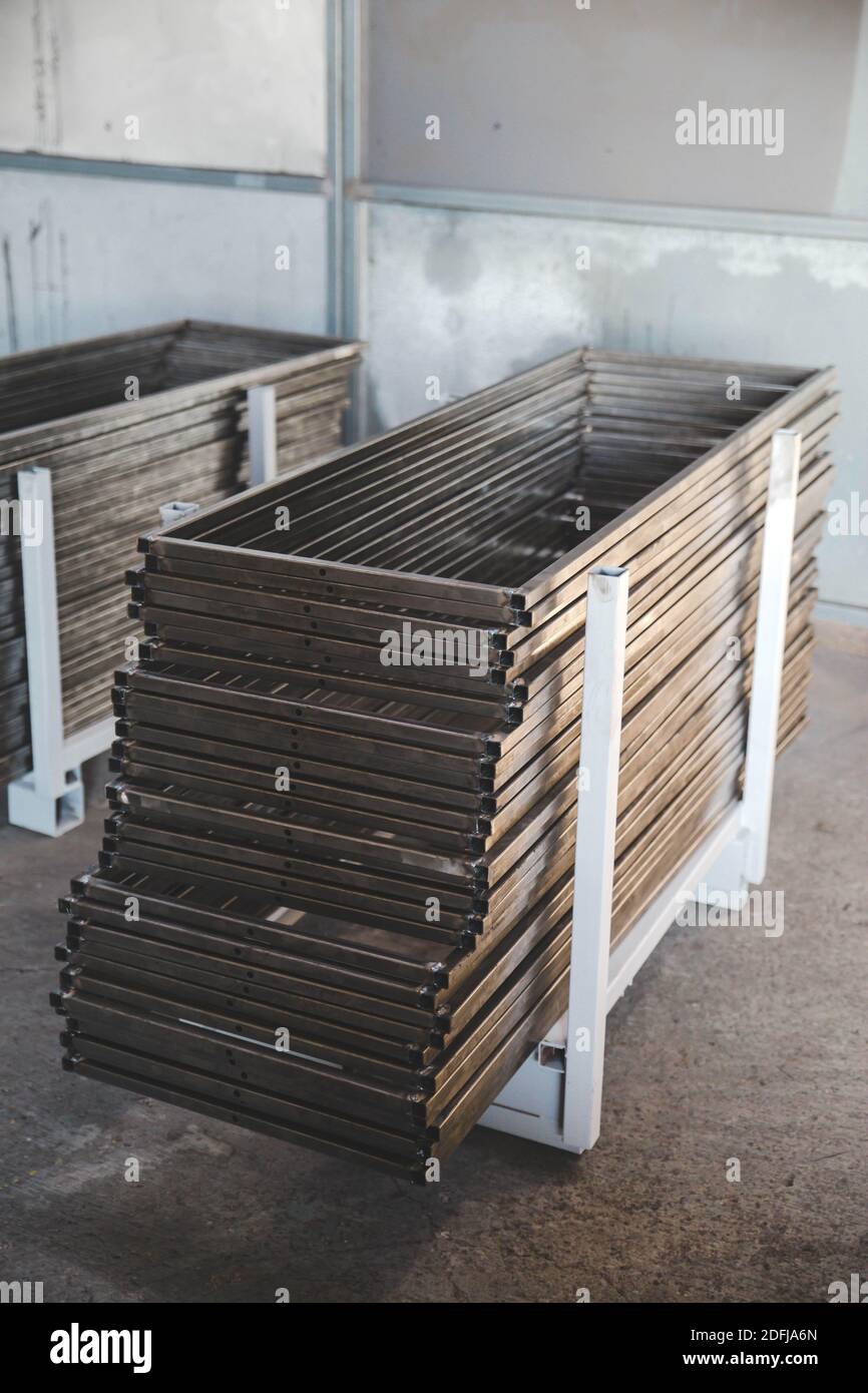 A selective focus shot of stacked welded metal profiles Stock Photo