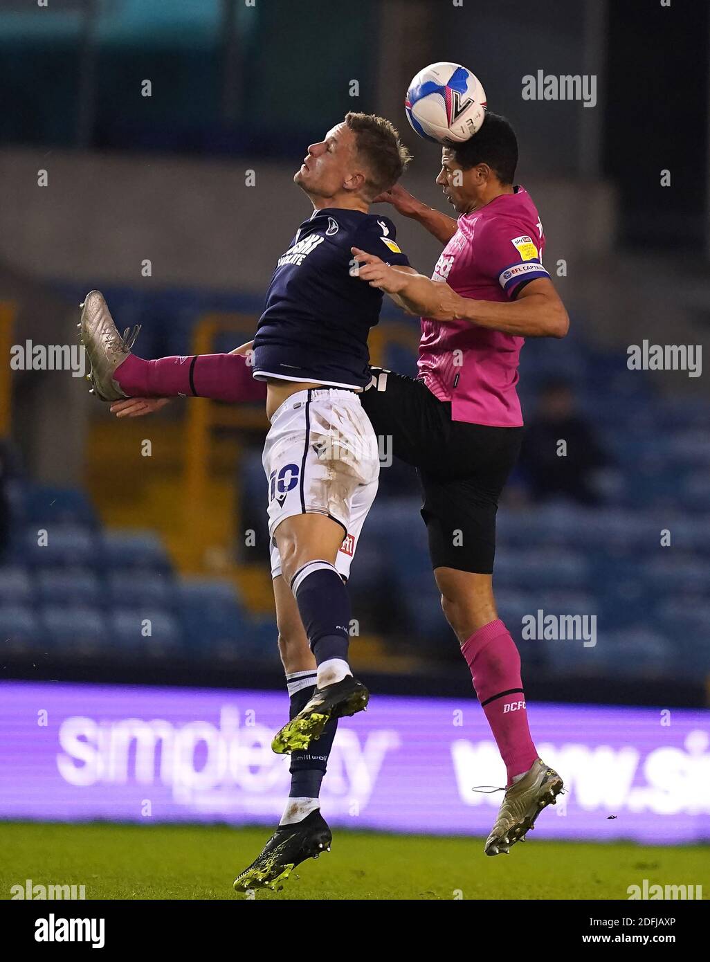 Millwall's Matt Smith (left) and Derby County's Curtis Davies battle