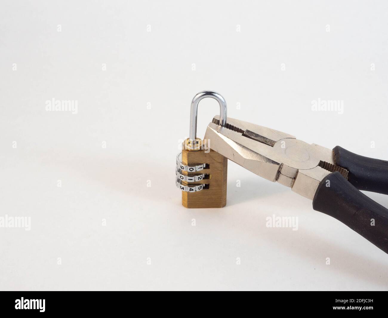 A closed padlock with wire cutters that is ready to open the padlock