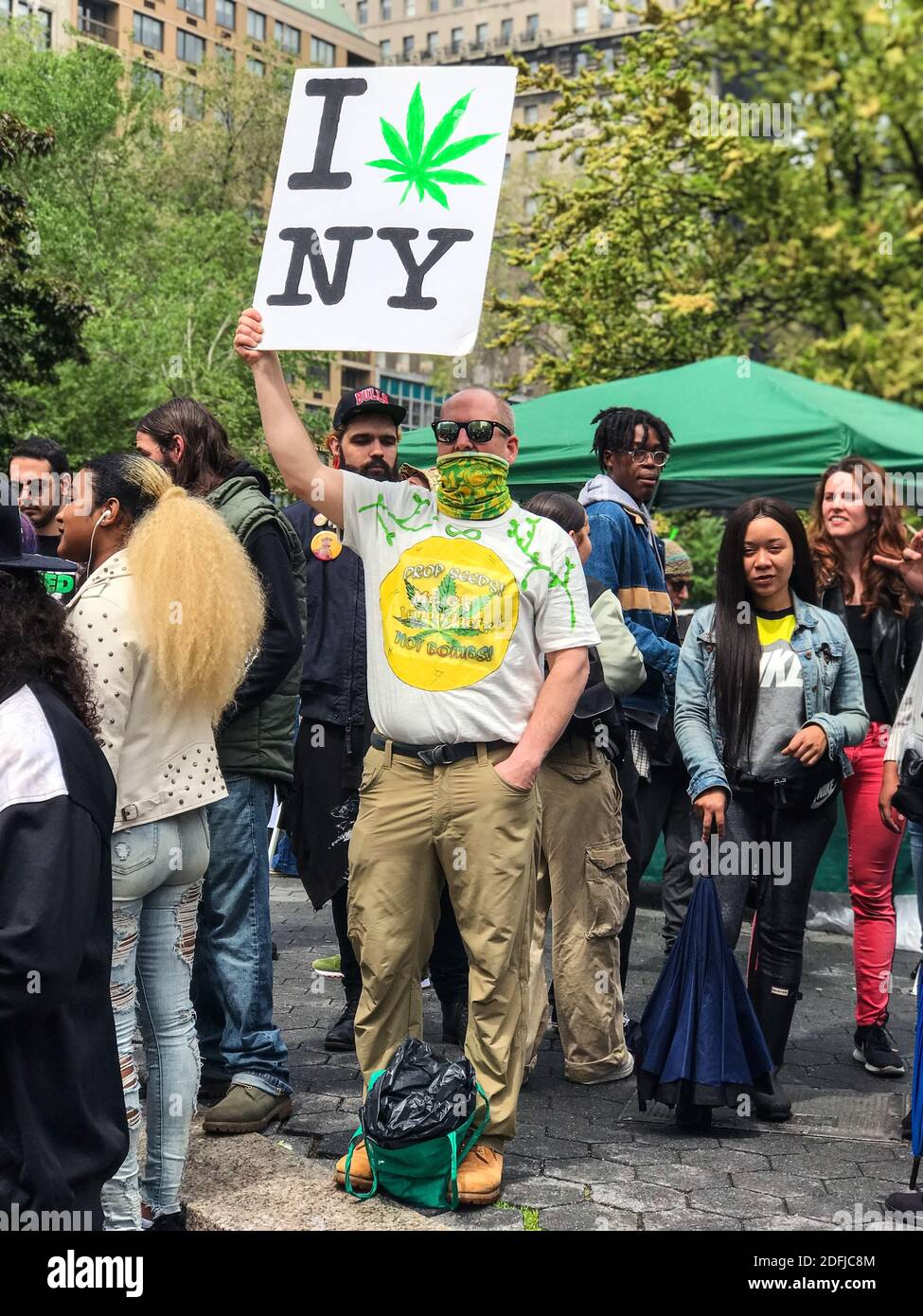 New York, NY, USA - May 4, 2019:  A person holds a sign that says 'I love New York' with a marijuana leaf in place of the heart symbol. Stock Photo