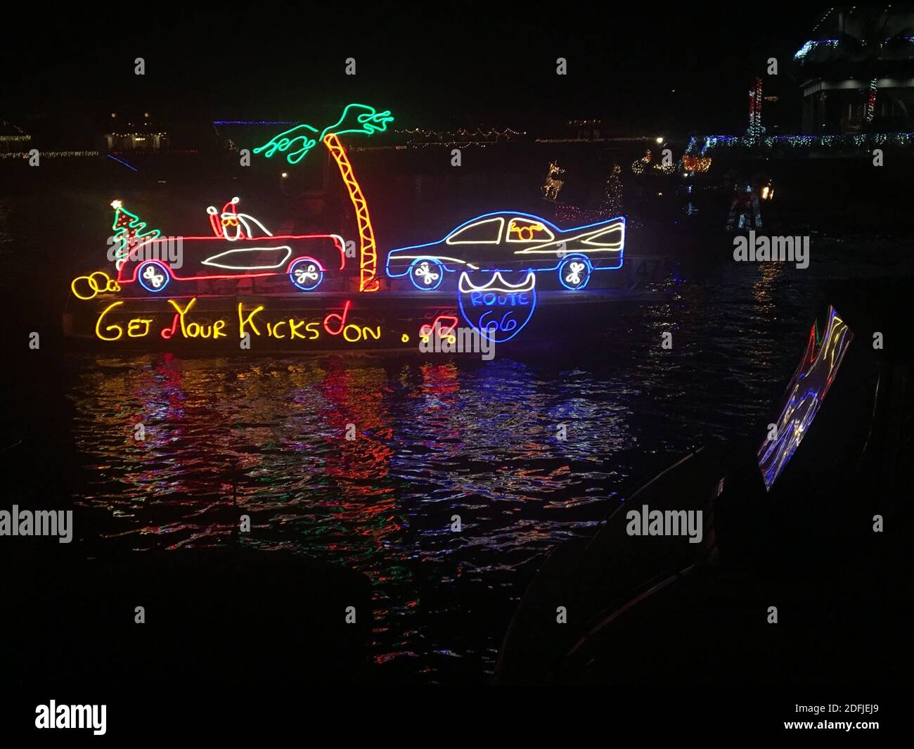Boat in harbor decorated with neon lights for Christmas Stock Photo Alamy