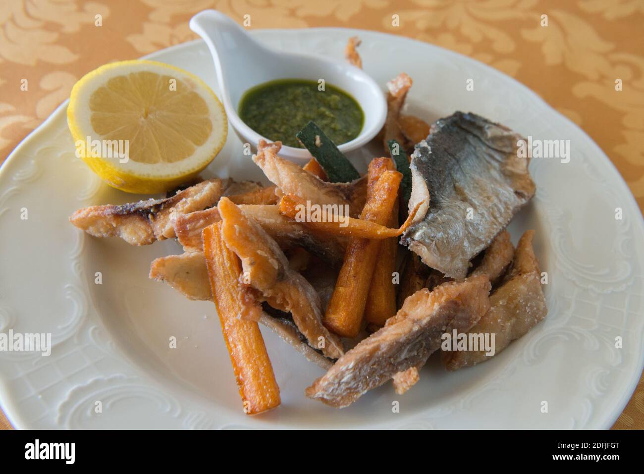 fish Agoni, con salsa verde,with green sauce Stock Photo
