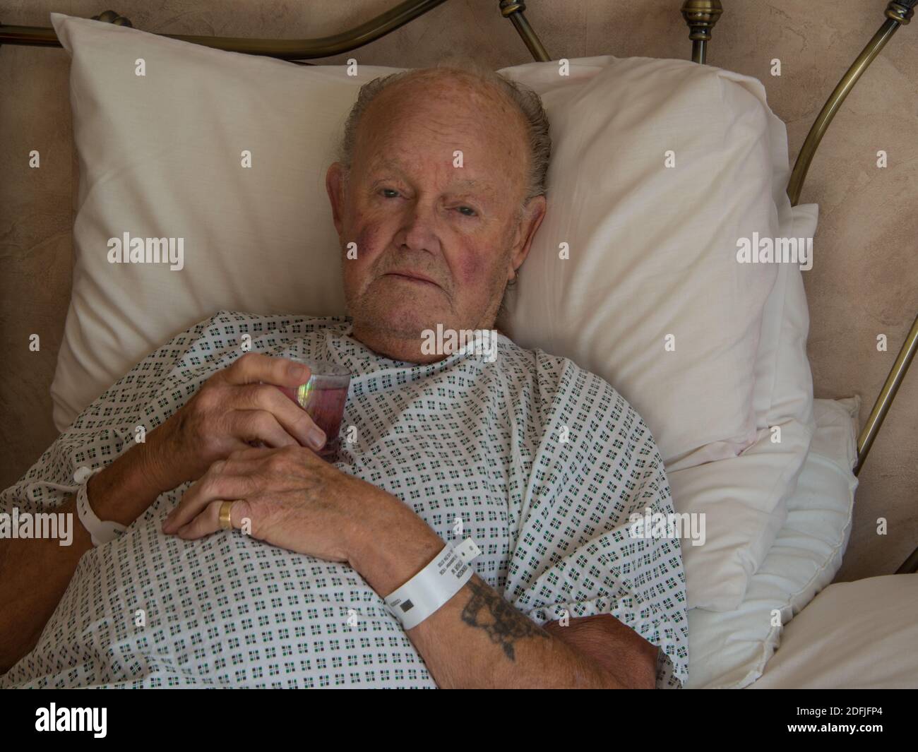 Elderly Man In Hospital Bed Stock Photo Alamy