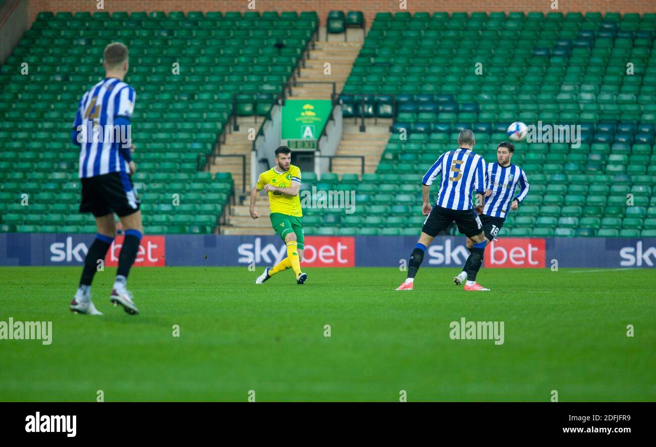 5th December 2020; Carrow Road, Norwich, Norfolk, England, English Football League Championship Football, Norwich versus Sheffield Wednesday; Grant Hanley of Norwich City swapping wings with the ball. Stock Photo
