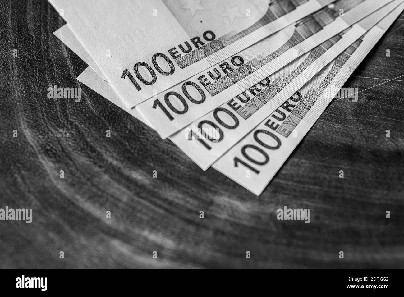 close in detail of the 100 euro banknote on wooden board Stock Photo