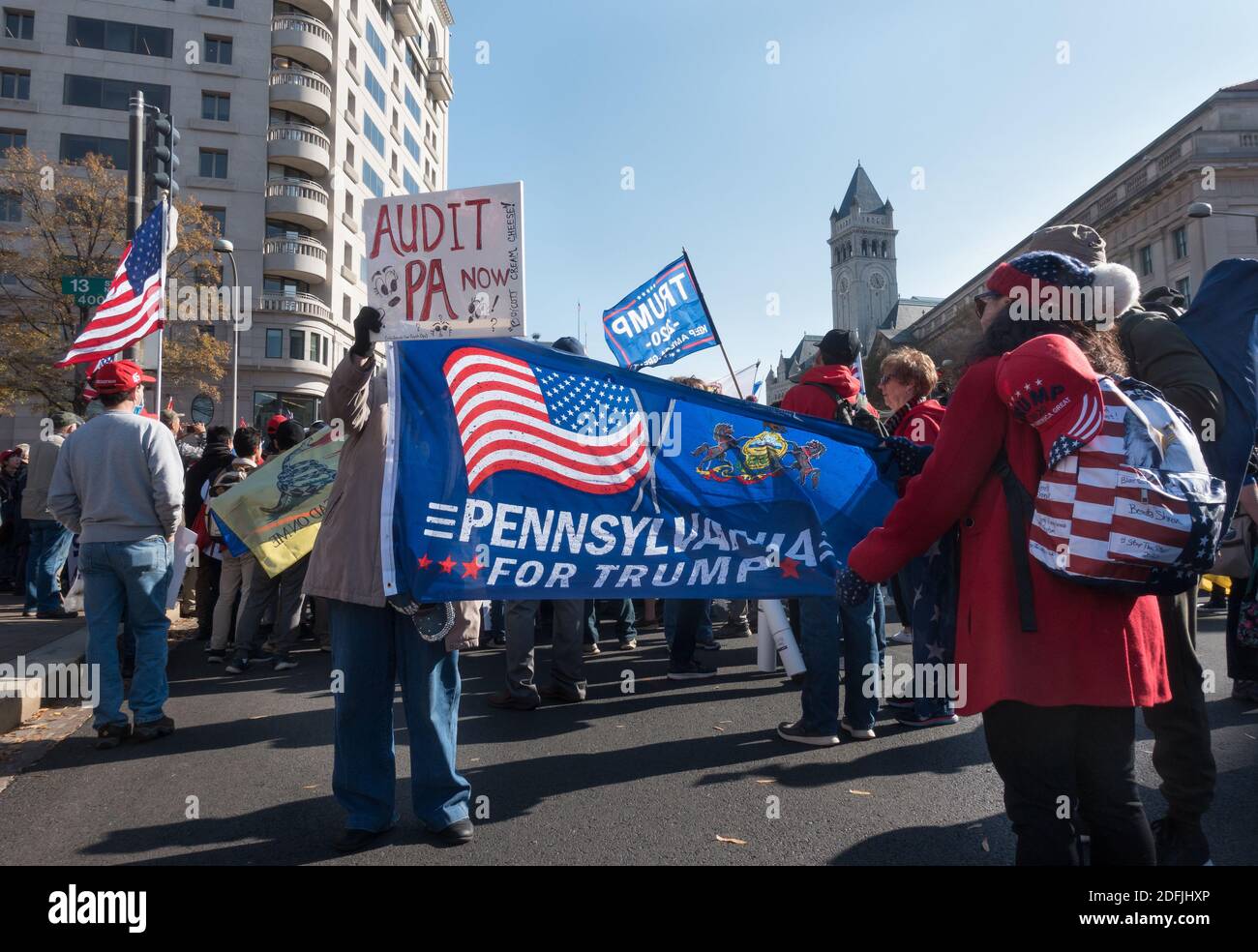 WASHINGTON, DC - NOV. 14, 2020: With Trump hotel in background, Trump supporters at Freedom Plaza rally in support of President Donald Trump, who refuses to concede the election. Event was organized by 'Women for America First,' 'Stop the Steal' and the 'Million MAGA March.' Stock Photo