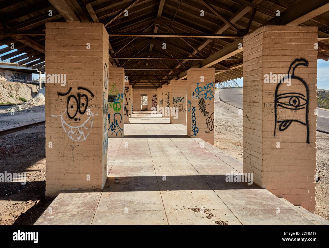 Graffiti covered brick columns in an abandoned railroad depot, Winterhaven, California Stock Photo