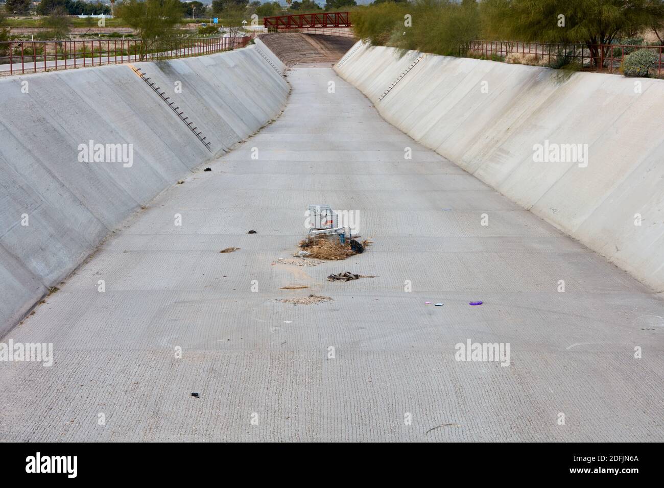 Shopping carts in the middle of a drainage canal leading to the Santa Cruz River, Tucson, Arizona Stock Photo