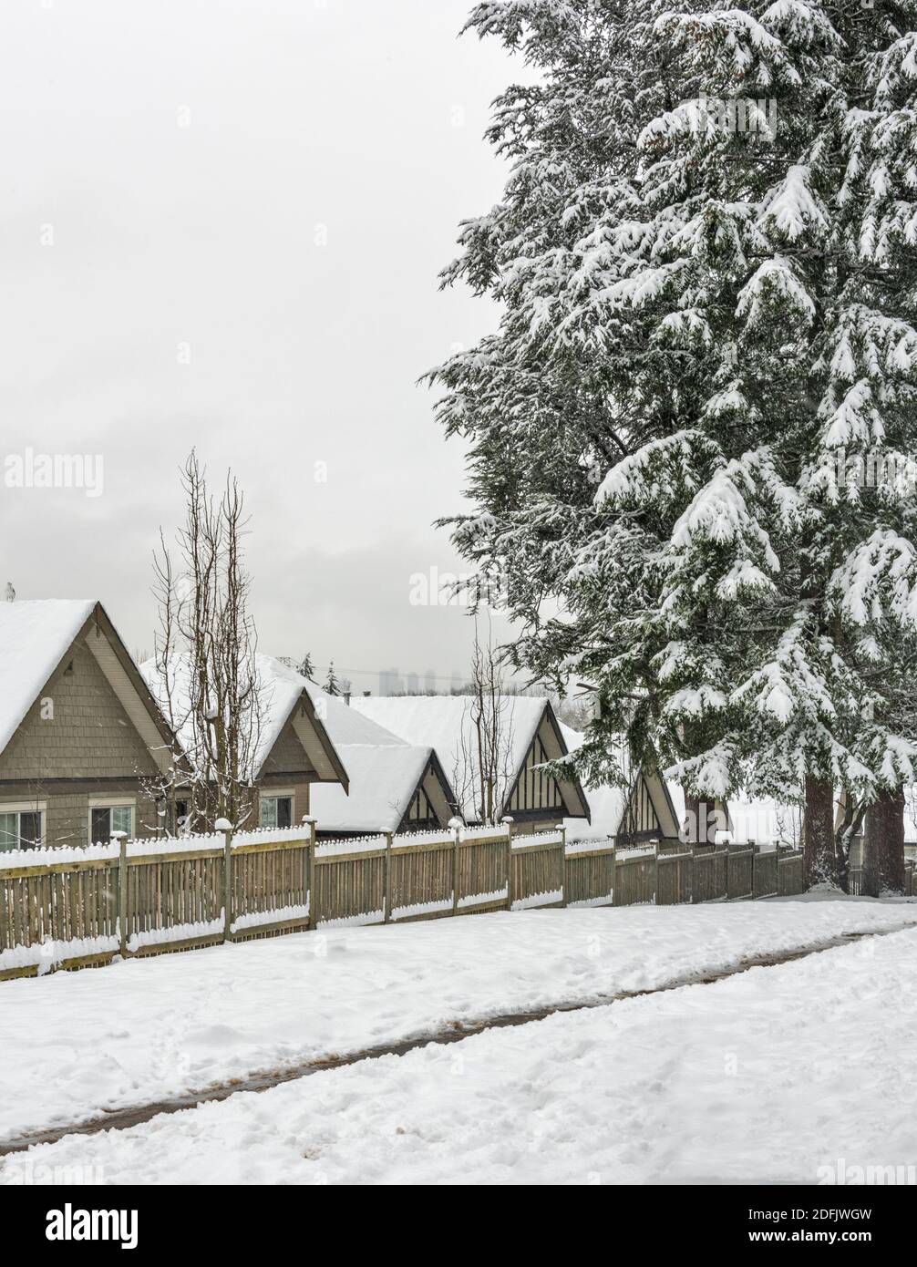 Row of residential houses in snow. Winter in Canada Stock Photo