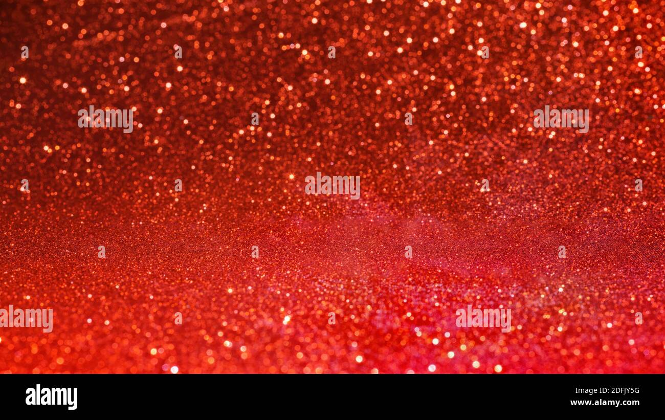 Red glittered fabric close up with selective focus Texture and background Stock Photo
