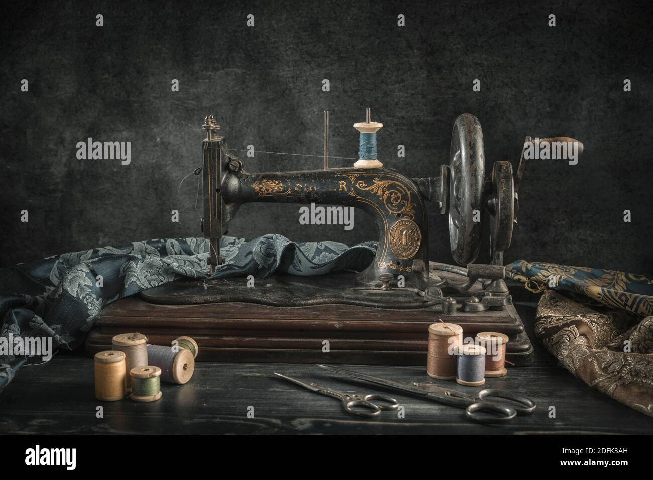 The sewing machine and accessories threads, needle, scissors