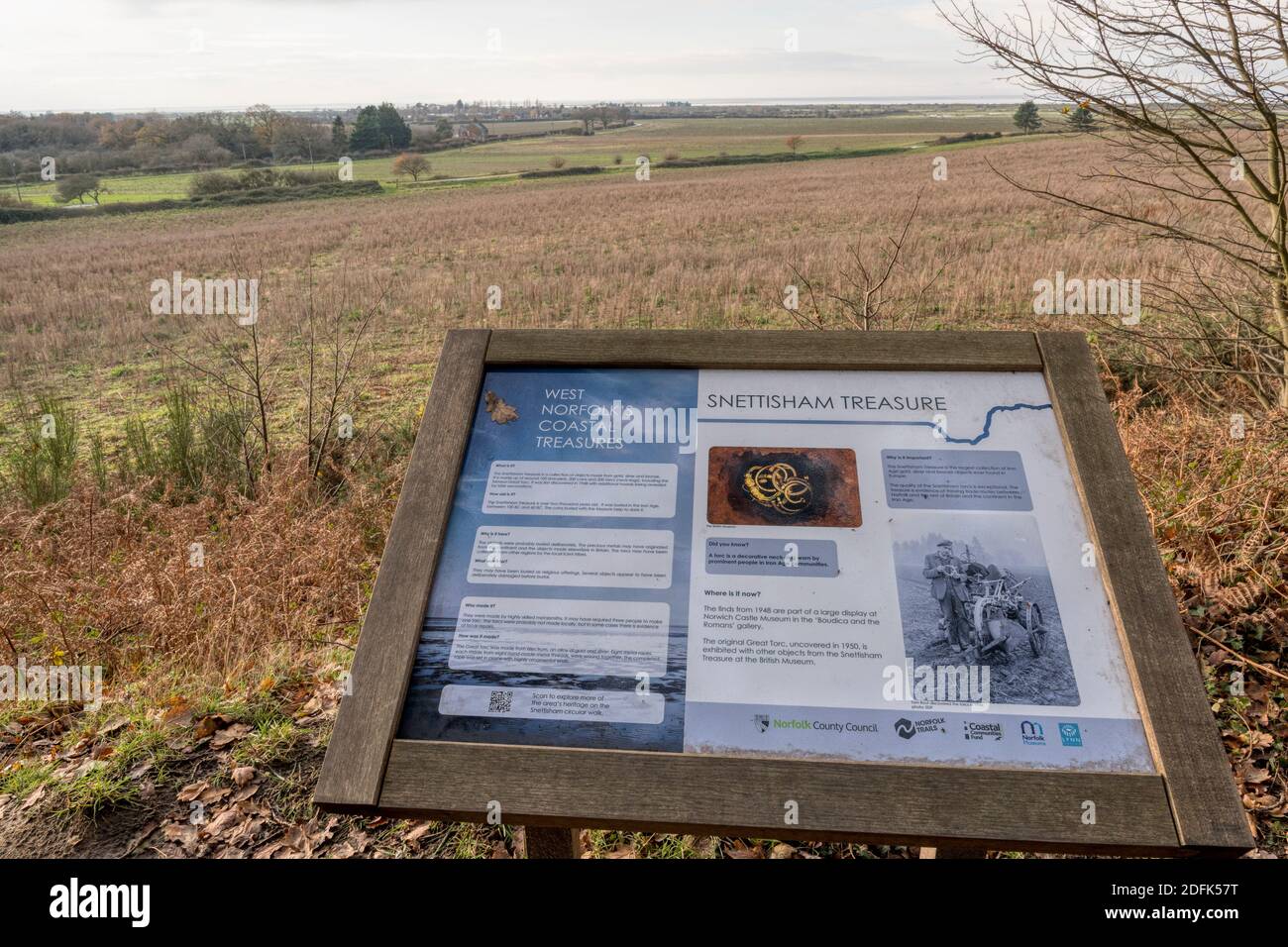 An informative panel about the Iron Age Snettisham treasure found in 1948.  Overlooking the fields on the edge of the Wash. Stock Photo