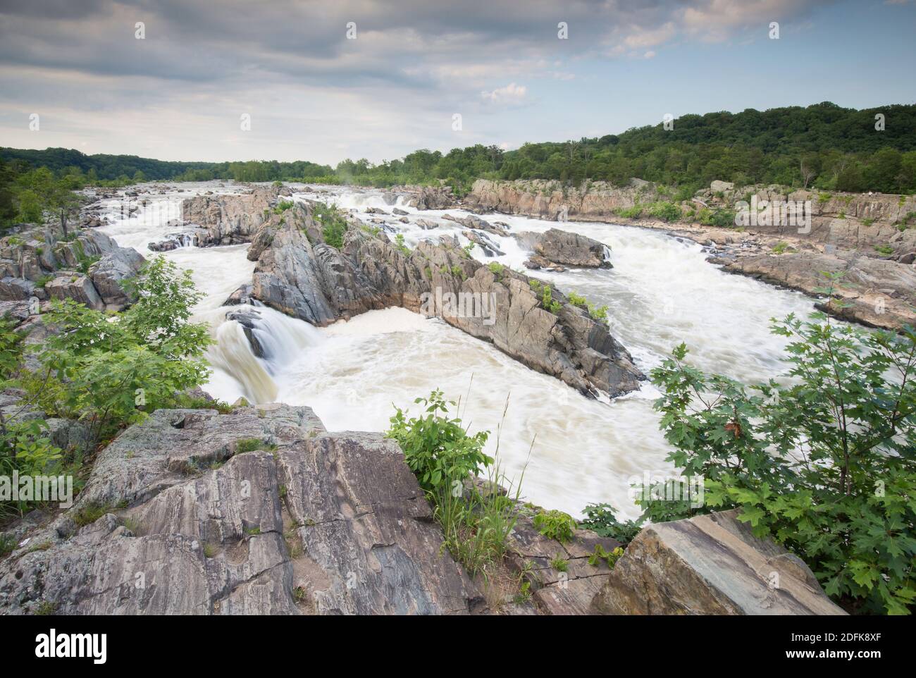 The Potomac River surges through a rocky gorge at Great Falls. Stock Photo