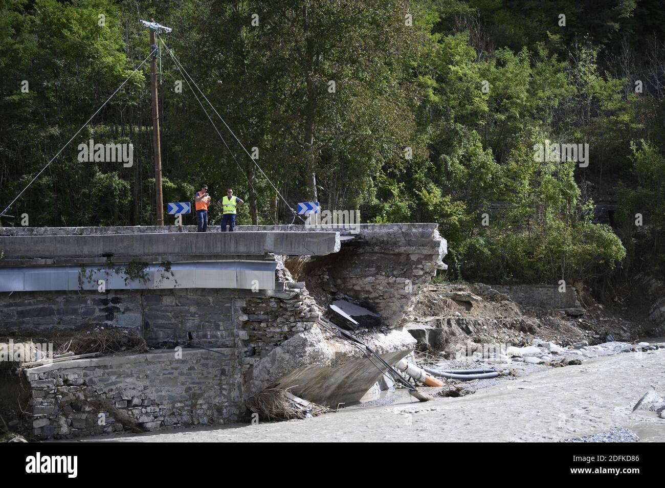The wreckage of a damaged bridge in Tende, in the Vallee de la Roya, some 50kms north-east of Nice, southeastern France, on October 7, 2020, after storms and extensive flooding caused widespread damage in the Alpes-Maritimes departement. Intense flooding hammered southeast France over the weekend of October 2, causing four confirmed deaths in France and two in Italy, with the toll expected to rise further as searches continue for survivors. Hundreds of people have been evacuated after storms dumped huge amounts of rain that turned streams into churning torrents that swept away cars, houses and Stock Photo