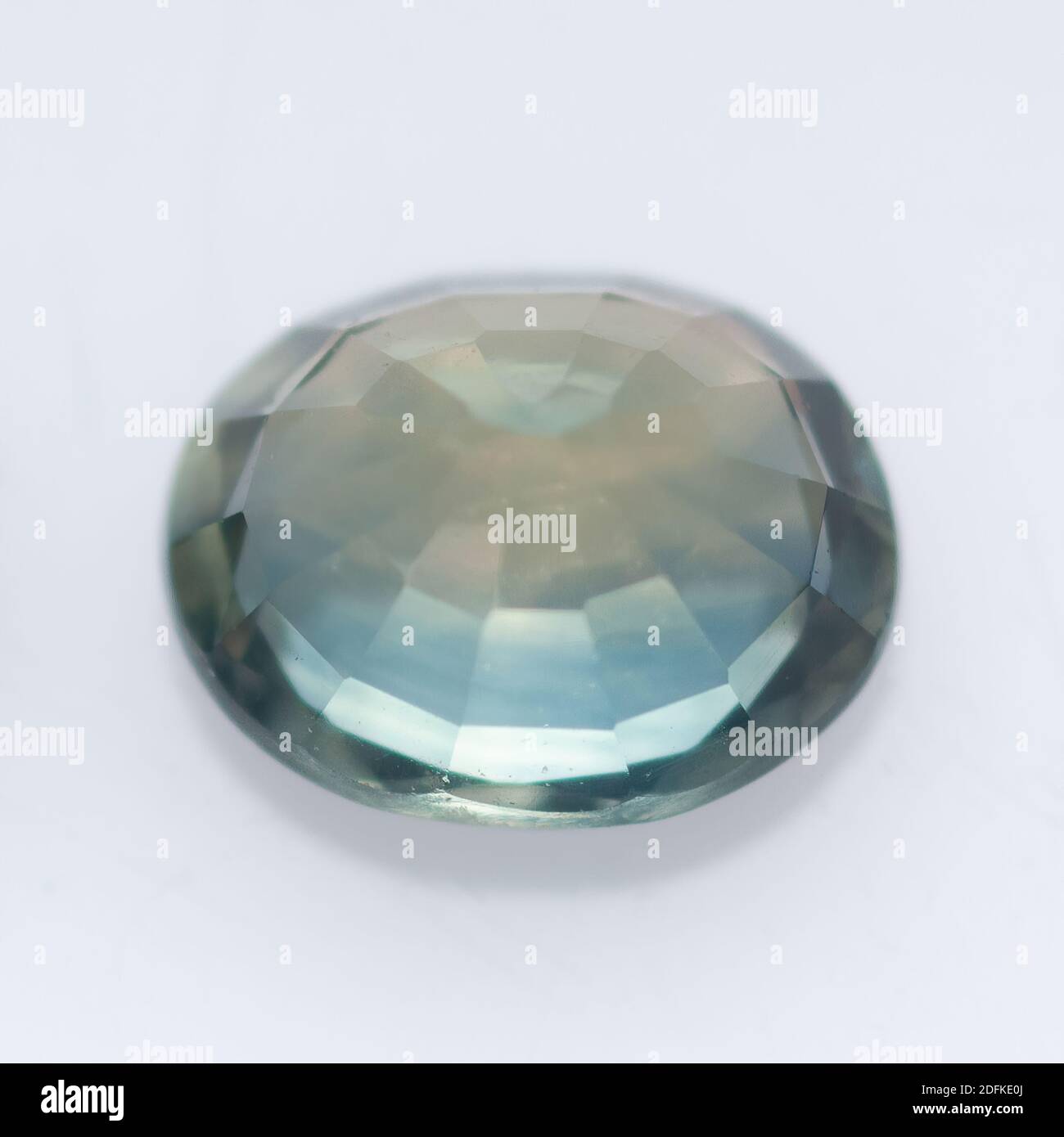 Natural blue sapphire on a white background Stock Photo