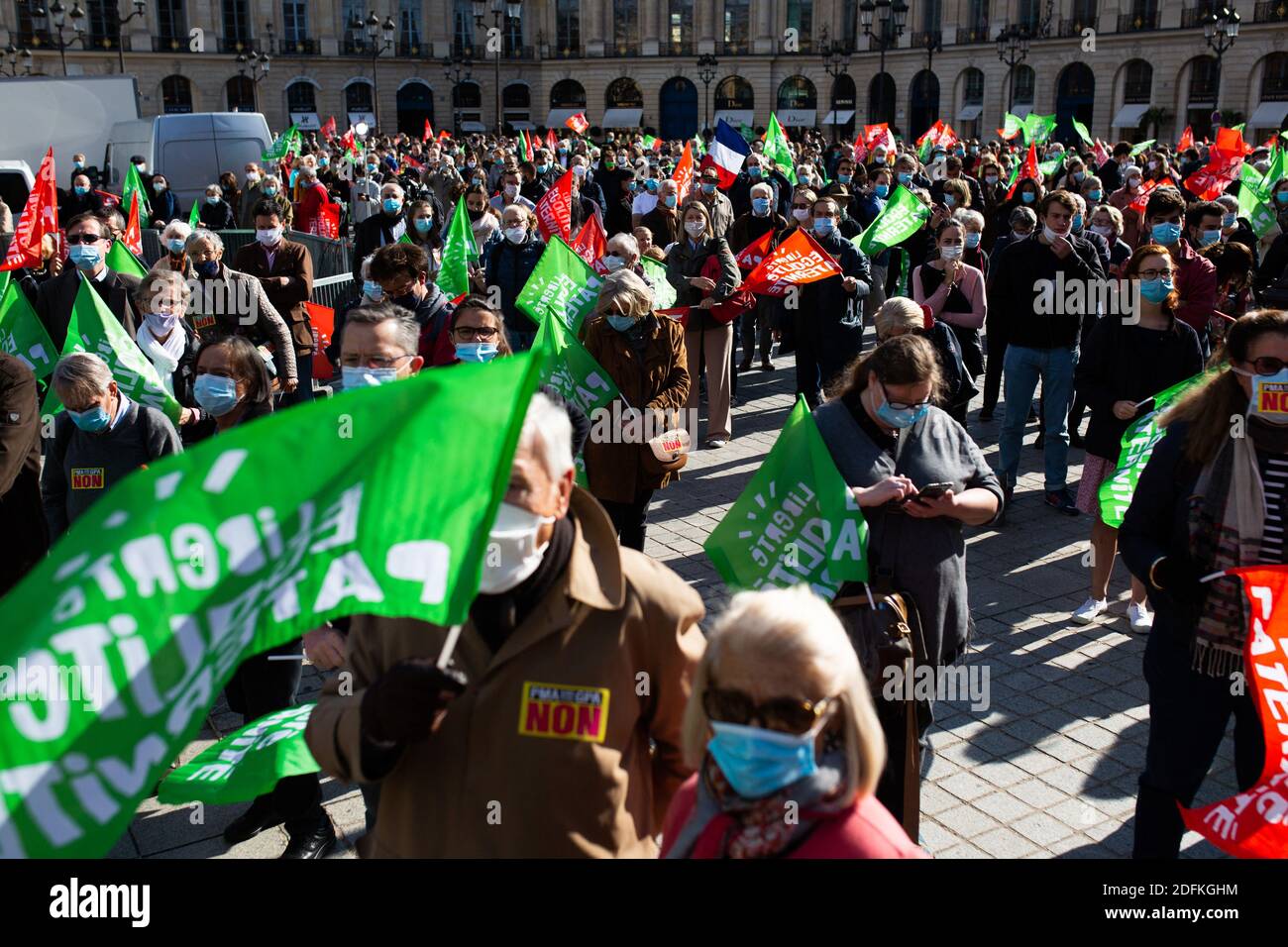 General view of Protesters hold liberty equality parternity flags during a protest called by pro-life conservative activist group 'La Manif Pour Tous'against the bioethics bill on Medically Assisted Reproduction (PMA - Procreation Medicalement Assistee), in Paris, France, on October 10, 2020. Voted on August 1 in the second reading at the National Assembly, the bill, whose flagship measure is the opening of medically assisted procreation to all women, is due to be examined by the Senate on a date not yet set, towards the end of the year or early 2021. Photo by Raphael Lafargue/ABACAPRESS.COM Stock Photo