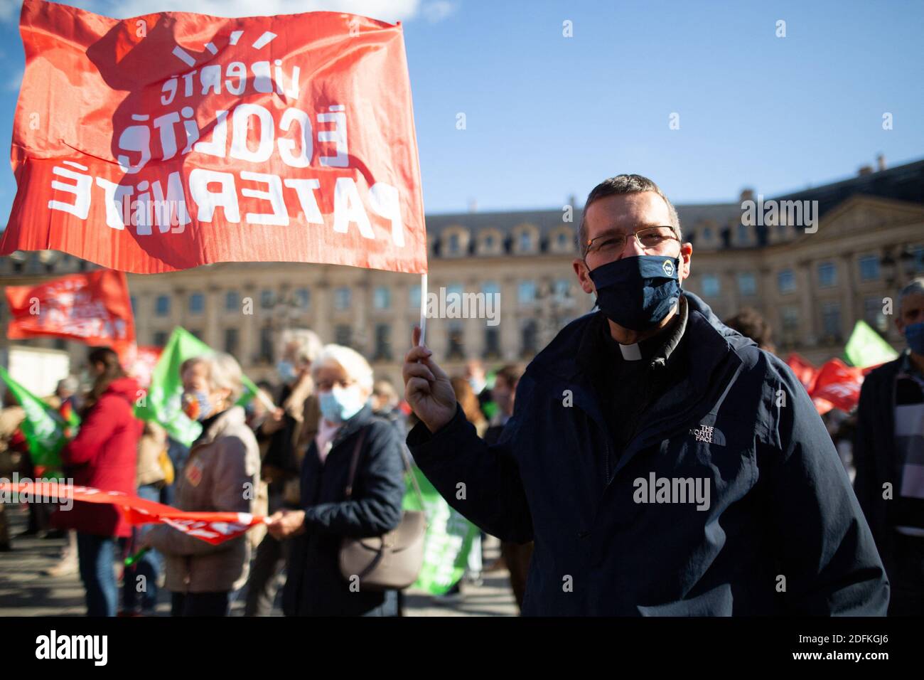 Church father Protesters hold liberty equality parternity flags during a protest called by pro-life conservative activist group 'La Manif Pour Tous'against the bioethics bill on Medically Assisted Reproduction (PMA - Procreation Medicalement Assistee), in Paris, France, on October 10, 2020. Voted on August 1 in the second reading at the National Assembly, the bill, whose flagship measure is the opening of medically assisted procreation to all women, is due to be examined by the Senate on a date not yet set, towards the end of the year or early 2021. Photo by Raphael Lafargue/ABACAPRESS.COM Stock Photo