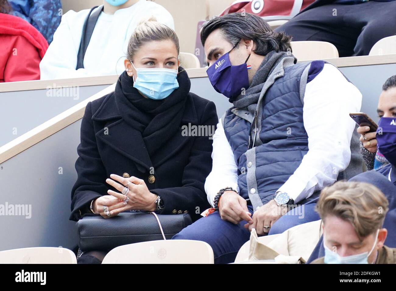 Laure Boulleau and her companion attend the Women's Singles Final on day  fourteen of the French Tennis Open at Roland Garros stadium on October 10,  2020 in Paris, France. Photo by Laurent