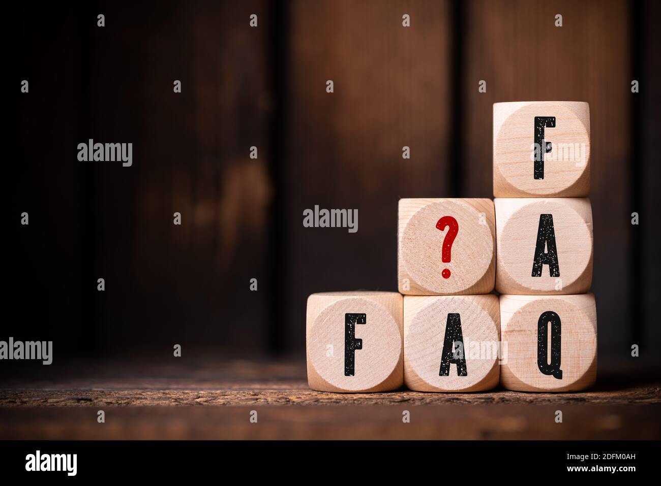 cubes with text FAQ on wooden background Stock Photo - Alamy