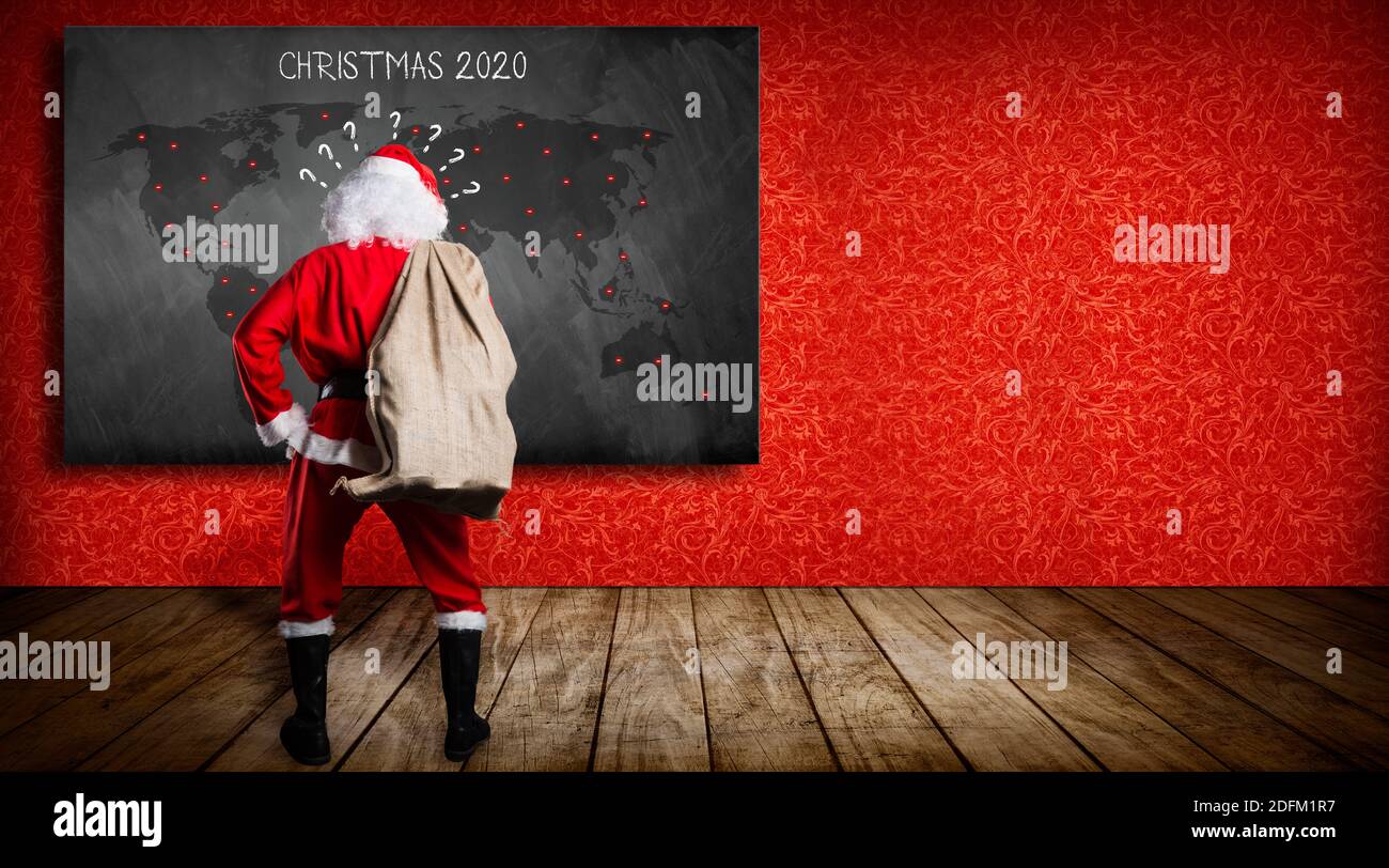 Santa Claus Map 2020 Confused Santa Claus In Front Of A Blackboard With A World Map And Message Christmas  2020 On Red Background Stock Photo - Alamy