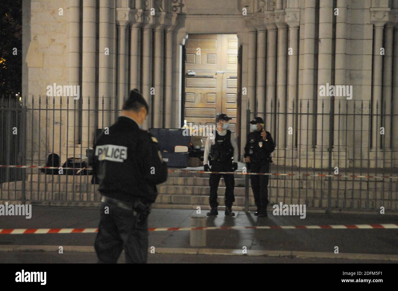 Police stand at night in front of Notre Dame Basilica on October 29, 2020 in Nice, France, after a man wielding a knife killed three people in the Basilica of Notre-Dame in the heart of the Mediterranean city. A knife attacker killed three people, cutting the throat of at least one woman, inside a church in Nice on October 29, in what France has called an Islamist terrorist attack. Photo by Pierre Rousseau/ABACAPRESS.COM Stock Photo
