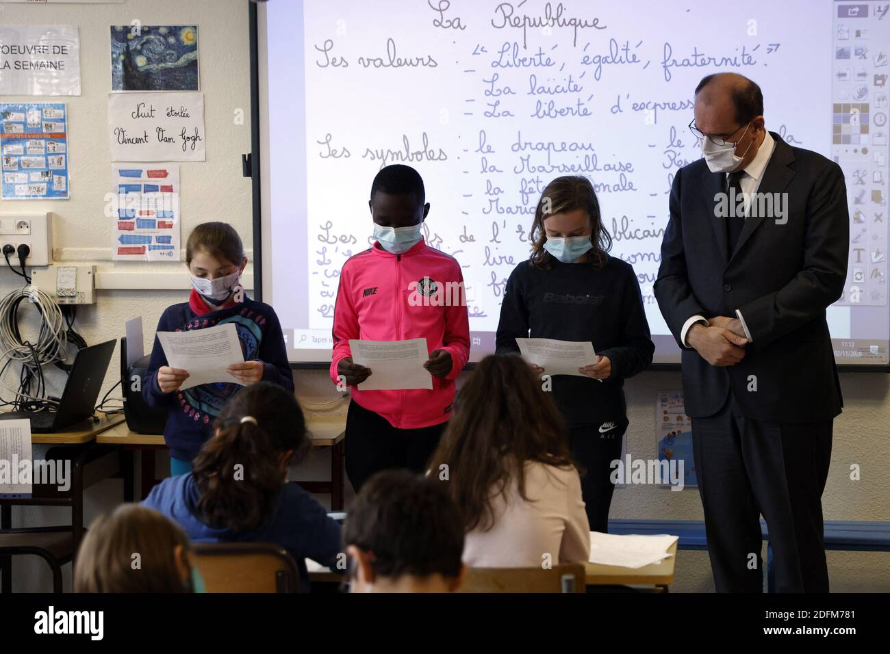French Prime Minister Jean Castex (R) attends a homage to slained French history teacher Samuel Paty, on November 2, 2020 at a school in Conflans Sainte-Honorine, as France honours the teacher beheaded in front of his school by a suspected Islamist radical. - Schoolchildren across France were to observe a minute of silence at 11:00 am (1000 GMT, as students returned to classes after the autumn break, to remember Samuel Paty, who was killed in Conflans-Sainte-Honorine, outside Paris, on October 16 just as the holiday began. Paty had shown his class a cartoon of the prophet Mohammed for a lesson Stock Photo