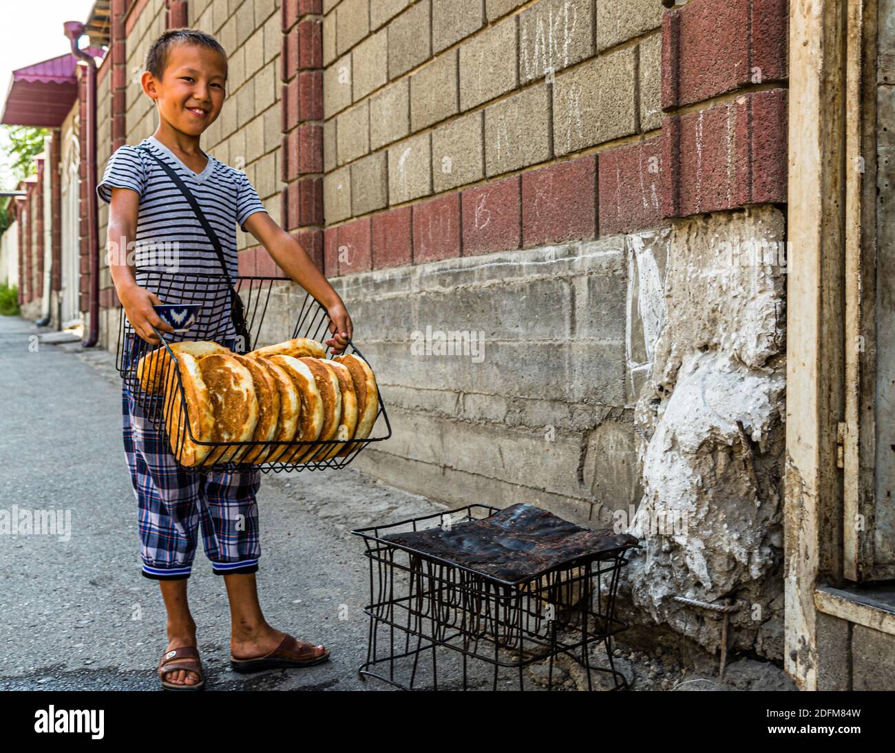 Fresh round Bread Tajik Non (Naan). Artisan Bread Bakery in the City of Osh, Kyrgyzstan Stock Photo