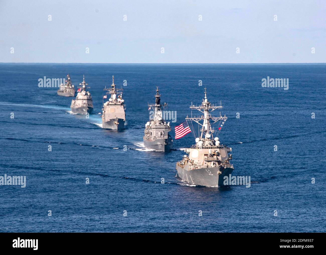 Handout photo dated October 26, 2020 of U.S. Navy ships assigned to the Ronald Reagan Carrier Strike Group joined ships of the Japan Maritime Self-Defense Force (JMSDF) Escort Flotilla 1, Escort Flotilla 4, and the Royal Canadian Navy in formation while aircraft from the U.S. Navy, U.S. Marine Corps, U.S. Air Force, JMSDF and Japan Air Self-Defense Force fly in formation during Keen Sword 21. U.S. Indo-Pacific Command forces and Japan Self-Defense Force units on Monday began the exercise Keen Sword 21 on military installations in mainland Japan. The joint biennial field training exercise for U Stock Photo