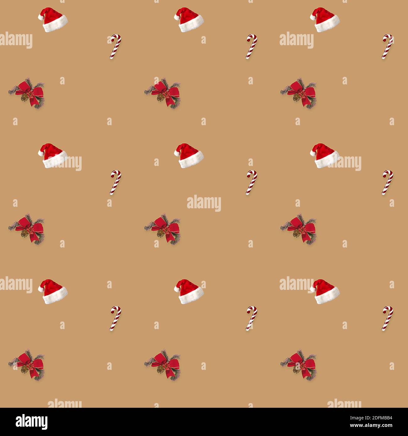 seamless pattern Santa hat, bow and candy cane candy cane on brown background Stock Photo
