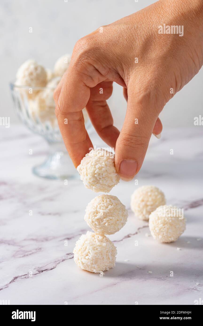 Coconut balls, ehite chocolate rafaello candies. Vegetarian round tasty