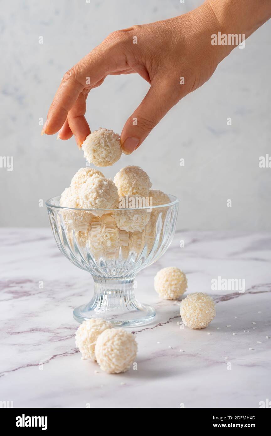 Coconut balls, ehite chocolate rafaello candies. Vegetarian round tasty