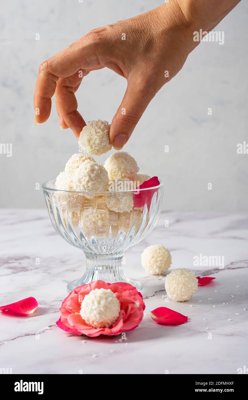 Coconut balls, ehite chocolate rafaello candies. Vegetarian round tasty