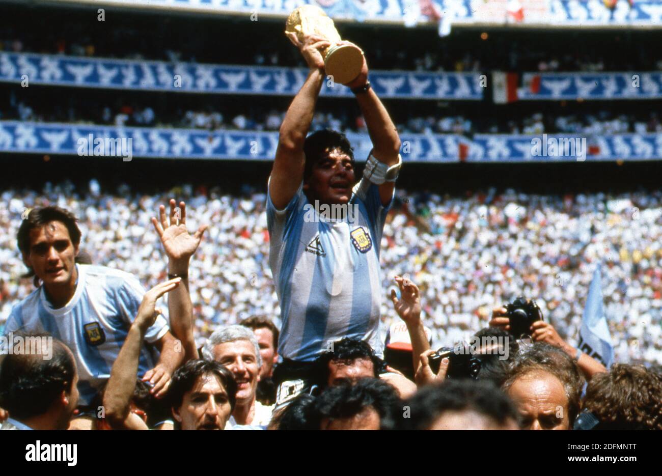 File photo dated June 29, 1986 of Argentine soccer star team captain Diego Armando Maradona displays the World Soccer Cup won by his team after a 3-2 victory over West Germany at the Azteca Stadium in Mexico City. Diego Maradona has died from a heart attack just days after turning 60. The Argentinian football legend died at home, his lawyer said, just two weeks after having surgery on a blot clot in his brain. Widely regarded as one of the greatest players of all time on the pitch, his life off the pitch was equally notorious - amid battles with drug and alcohol addiction. Photo by Giuliano Be Stock Photo