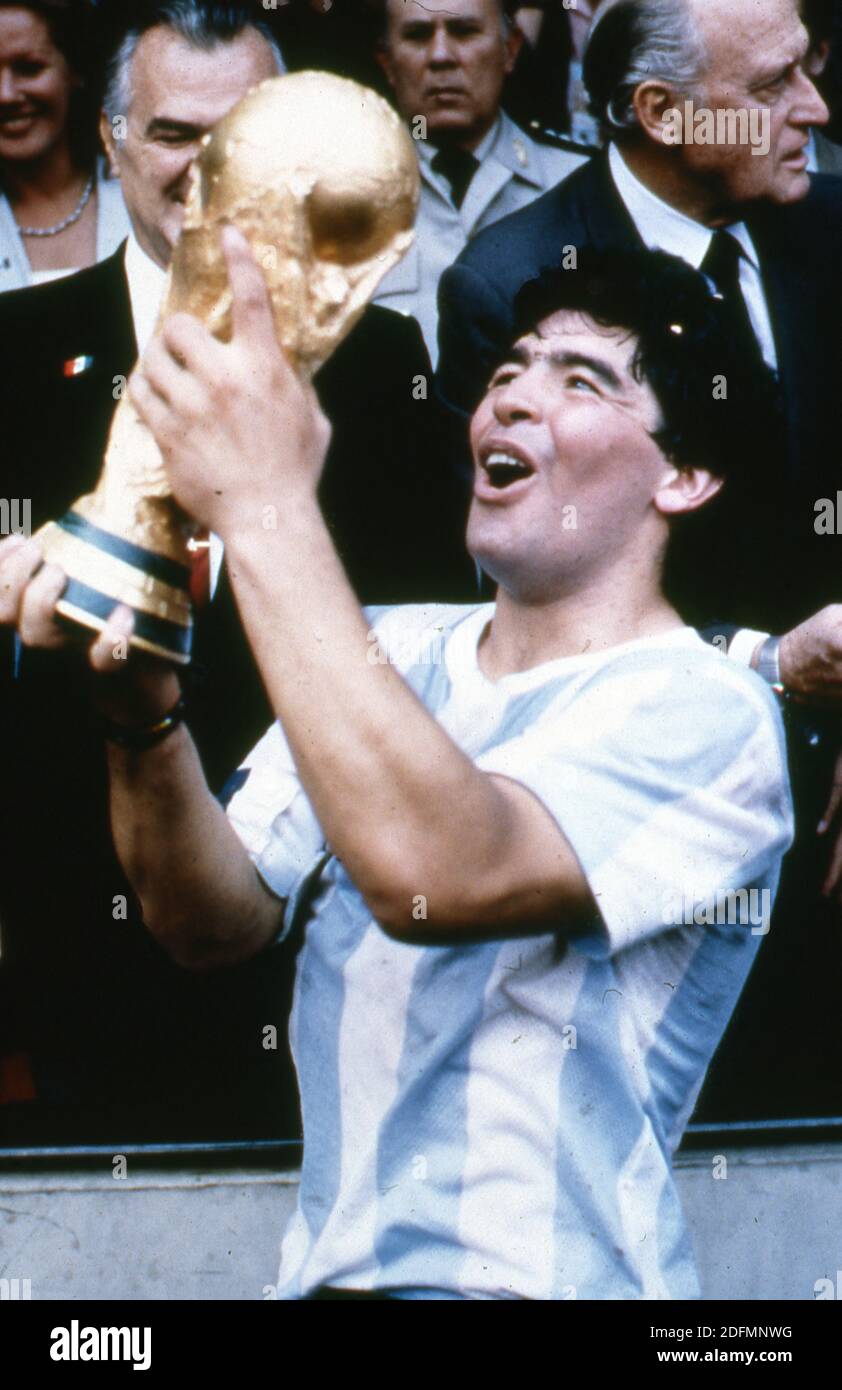 File photo dated June 29, 1986 of Argentine soccer star team captain Diego Armando Maradona displays the World Soccer Cup won by his team after a 3-2 victory over West Germany at the Azteca Stadium in Mexico City. Diego Maradona has died from a heart attack just days after turning 60. The Argentinian football legend died at home, his lawyer said, just two weeks after having surgery on a blot clot in his brain. Widely regarded as one of the greatest players of all time on the pitch, his life off the pitch was equally notorious - amid battles with drug and alcohol addiction. Photo by Giuliano Be Stock Photo