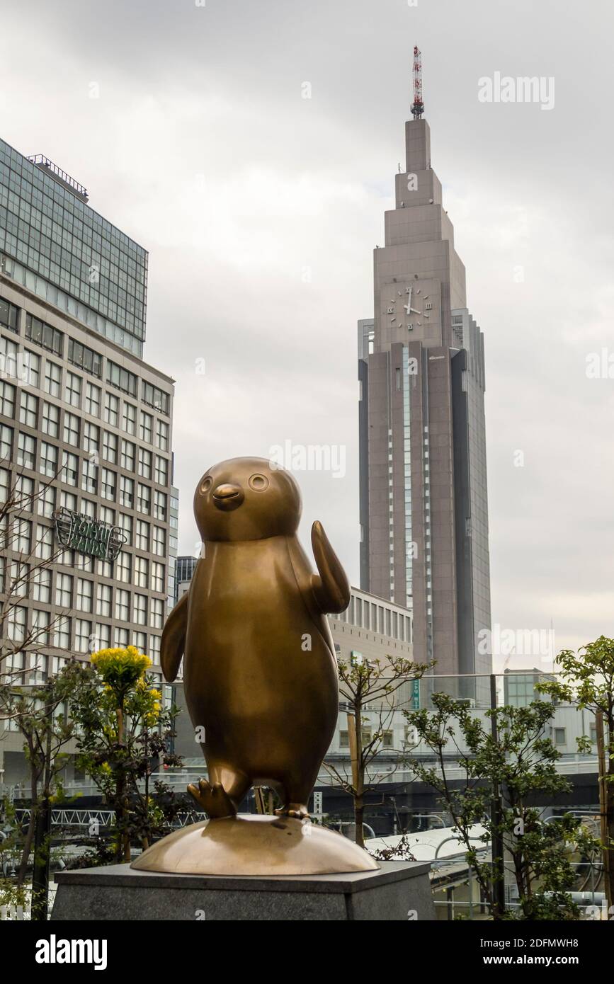 Statue of Sucia Penguin at Shinjuku Station in Tokyo Stock Photo
