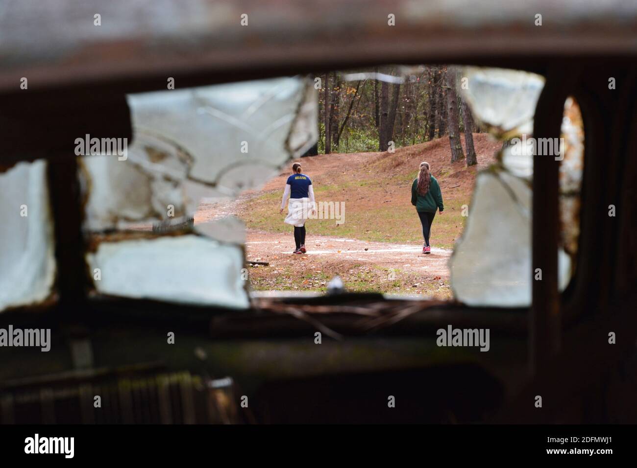 Looking through the broken windshield of an old race car at the former Occoneechee Speedway that today has been converted to a hiking trail Stock Photo