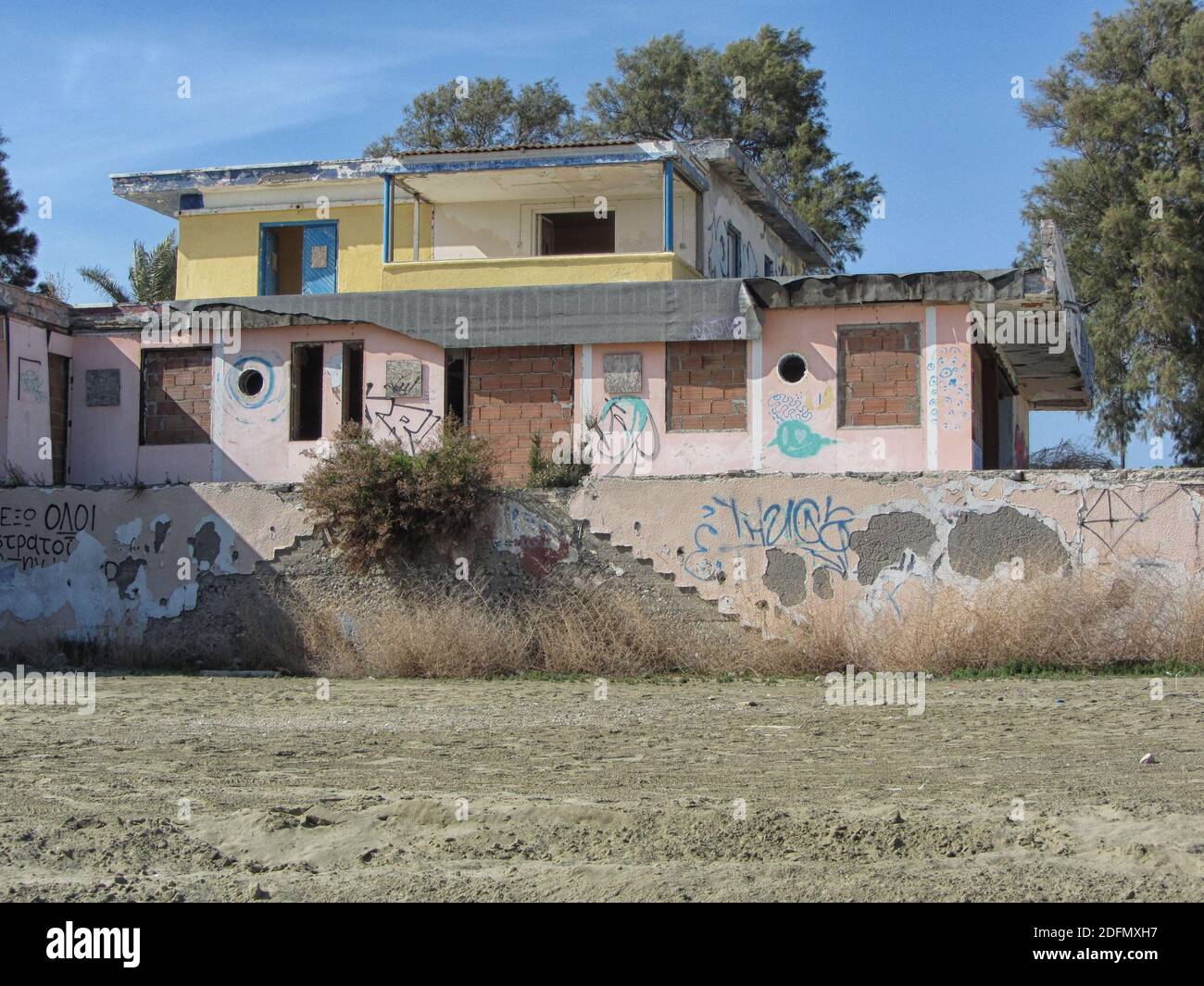 Old abandoned desolate building by the sea in Cyprus Stock Photo