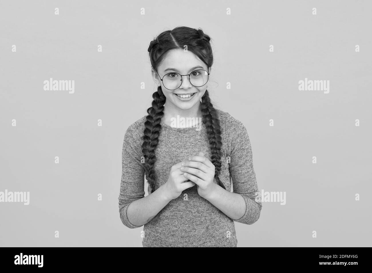 Smart girl bad eyesight. Reading better with eyeglasses. Cute