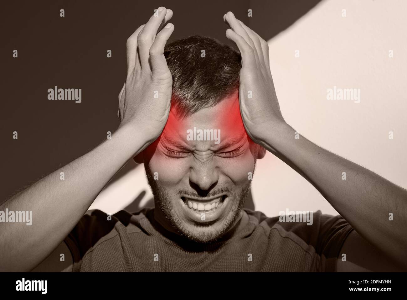 Man suffering from painful migraine or strong tension headache. Cluster