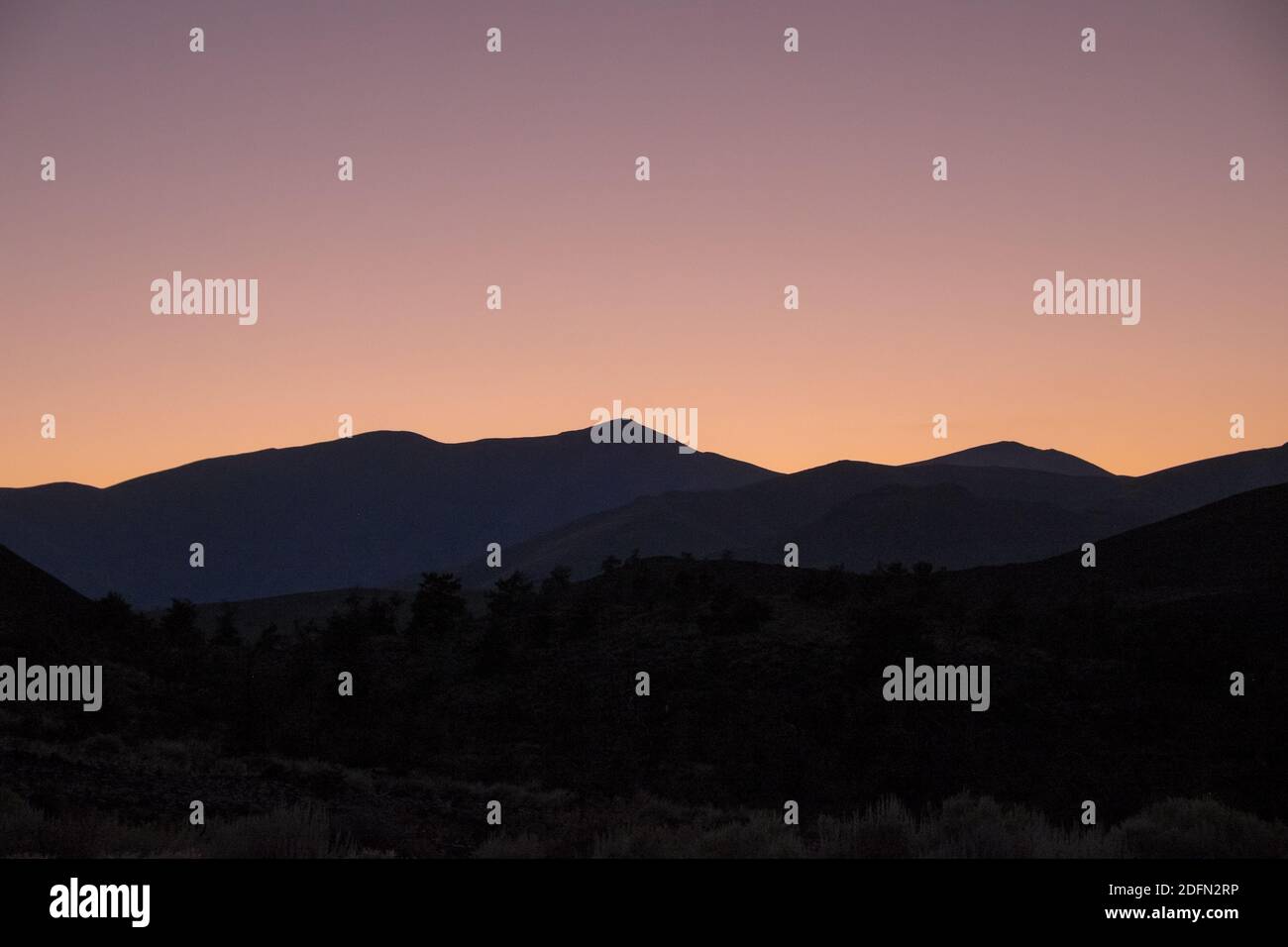 Craters of the Moon, Idaho, evening sky over the mountains, blank space for copy Stock Photo