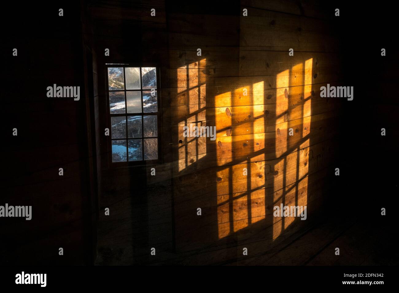 Double exposure of windows in a miner's house at the abandoned town of Animas Forks, Colorado, USA Stock Photo