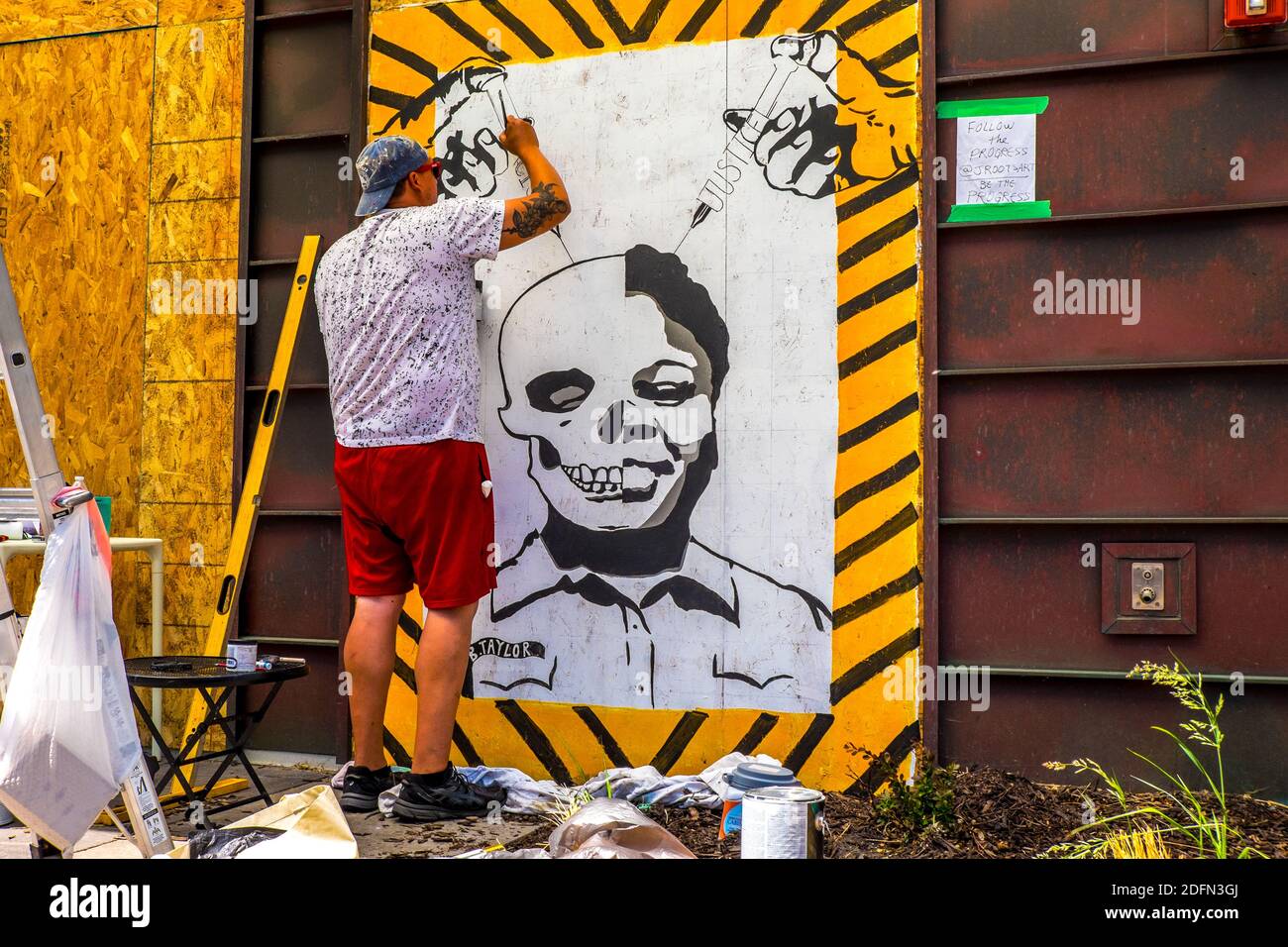 An artist in Uptown Minneapolis creates a painting of Breonna Taylor during the George Floyd protests Stock Photo