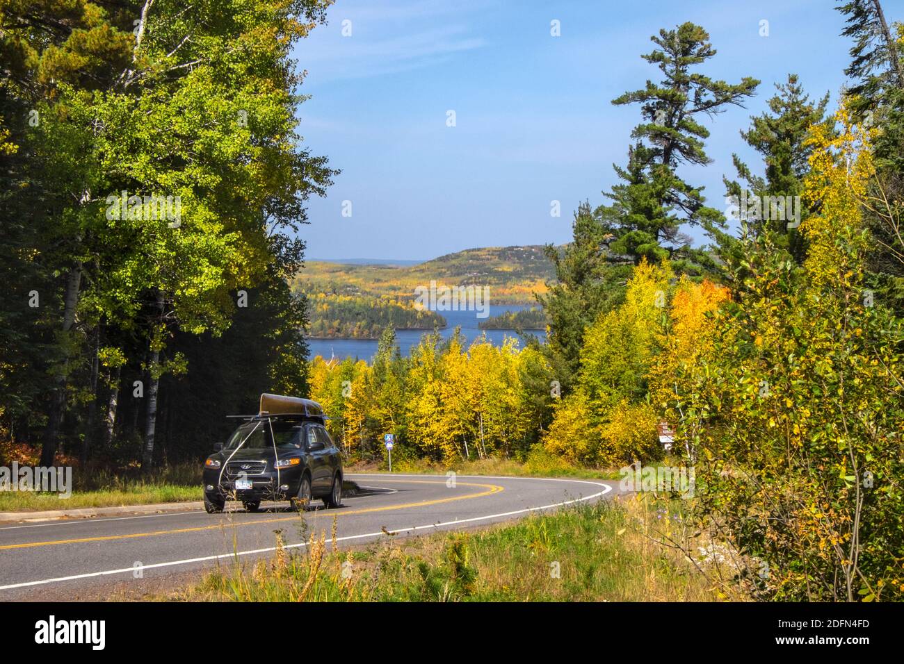A road through autumn foliage, Gunflint Lake, Minnesota, USA Stock Photo